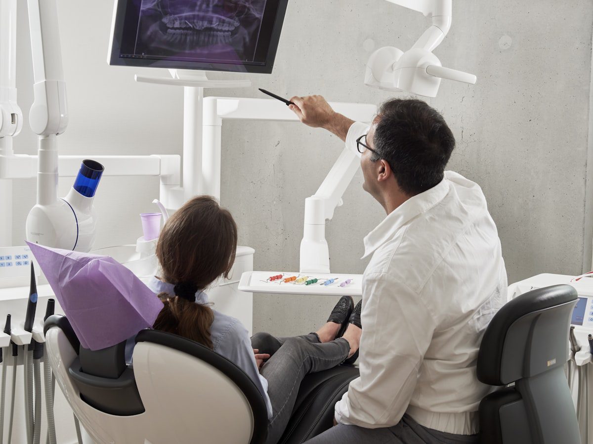 Langley dentist reviewing a dental X-ray with a patient about dental sealants