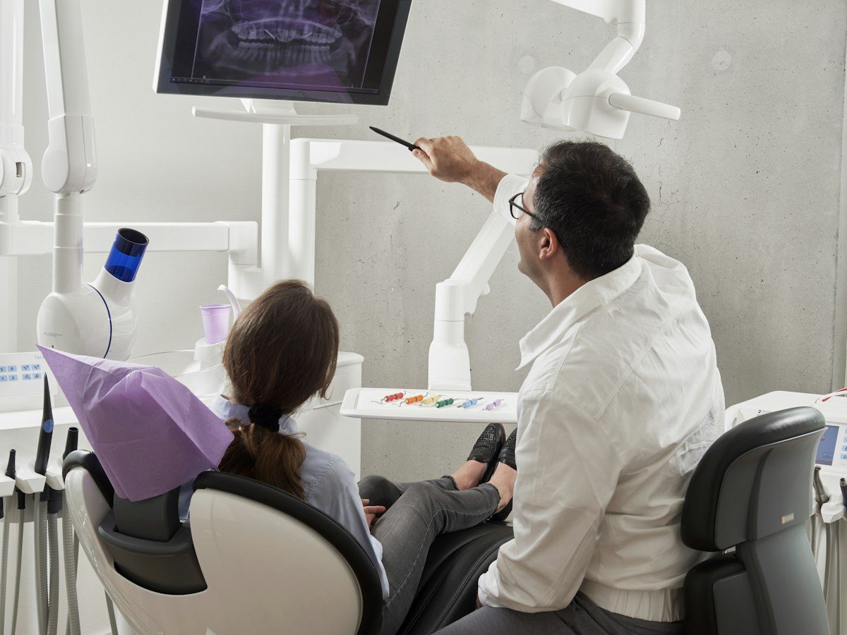 Langley dentist reviewing dental X-rays with a patient during a checkup