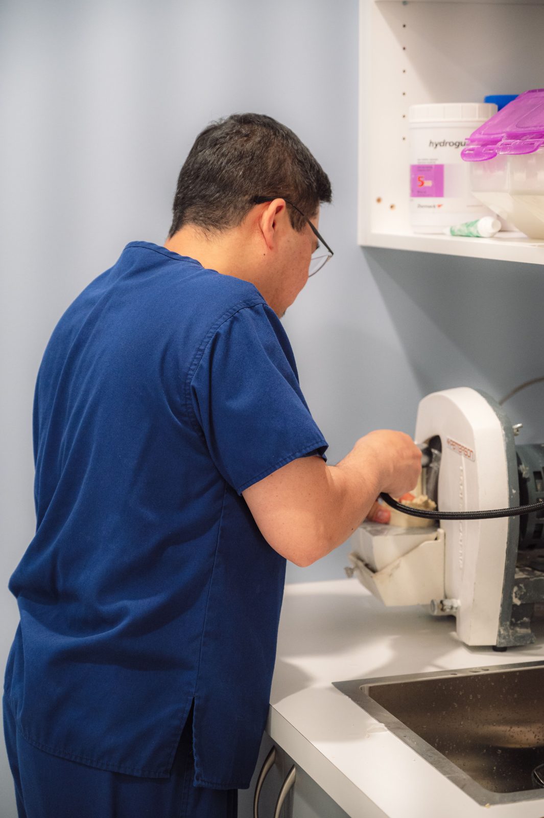 Allan Diaz, denturist, working in the dental lab at iSmile Dental in Langley, BC