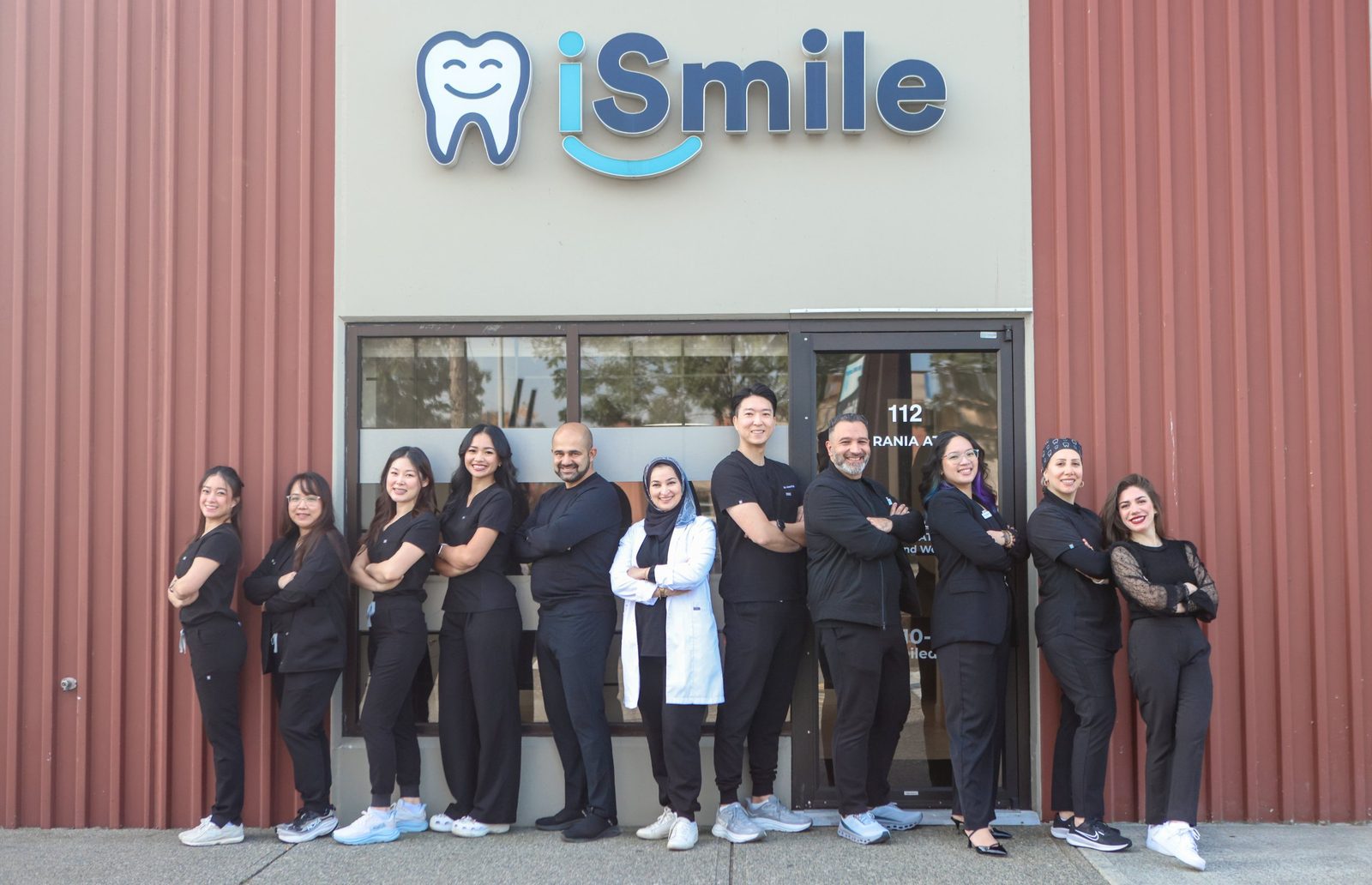 The iSmile Dental team standing outside the clinic at 6375 202 Street in Langley, BC